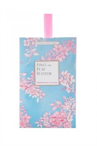 shows a fragranced sachet with its design of pink blossom on a blue background
